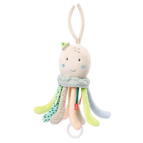 Die Spieluhr Oktopus hat ein lächelndes Gesicht, acht bunte, strukturierte Tentakel, einen niedlichen Hut und einen weißen Ring, der eine beruhigende Melodie spielt - ideal als Einschlafhilfe für Babys.