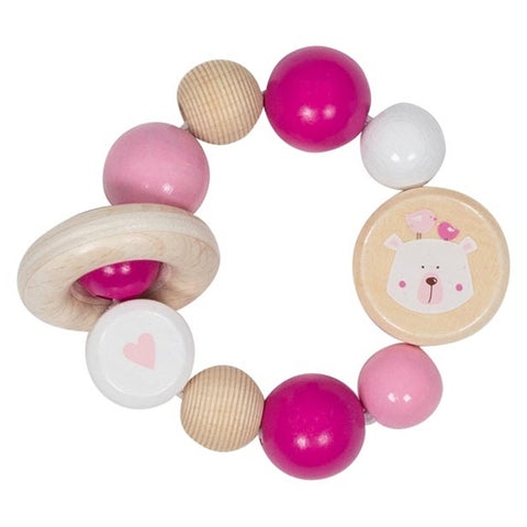Der Greifling Elastik Eisbär, rosa ist ein kreisrunder Goki Baby-Beißring aus Holz mit rosa, weißen und natürlichen Perlen, die mit Herz- und Bärenmotiven auf zwei Perlen versehen sind und die motorischen Fähigkeiten der kleinen Hände fördern.