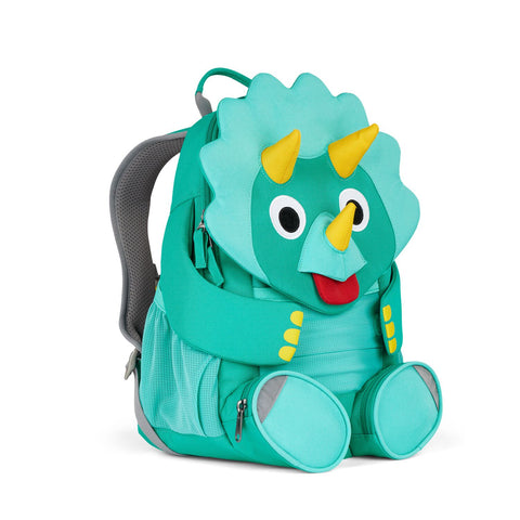 Der Affenzahn - Großer Freund Dino ist ein türkisfarbener Kindergartenrucksack in Form eines Cartoon-Triceratops, mit Hörnern, Augen, Füßen, seitlichen Netztaschen und gepolsterten Schultergurten für mehr Komfort.