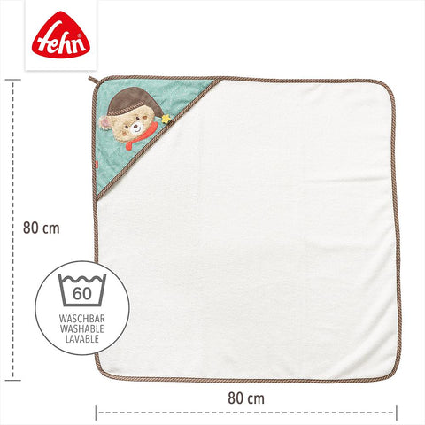 Das Kapuzenbadetuch Bär ist ein quadratisches weißes Kapuzenhandtuch mit braunem Rand, aus weichem Frottee, mit einem Bärenmotiv in einer Ecke, 80 x 80 cm groß und waschbar bei 60°C.